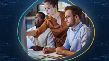 A team of colleagues collaborating on a project at work.